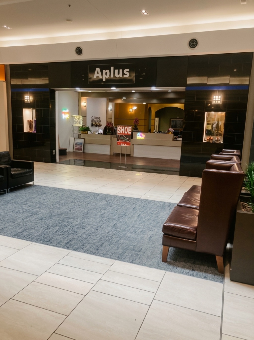 The Aplus storefront at Cherry Hill Mall — black tile facade with the Aplus sign, CLOTHING ALTERATIONS sign visible inside, and SHOE / KEY signs on the counter.